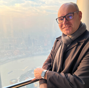 Man looks at camera in Shanghai Tower